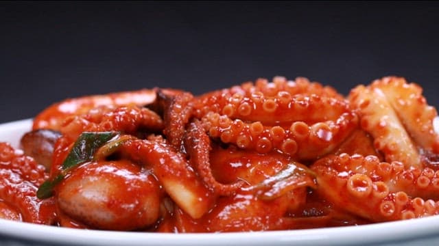 Spicy seafood tteokbokki with webfoot octopus in plate