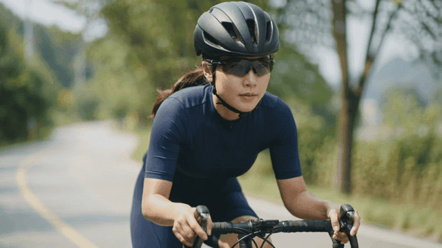 People riding bicycles on scenic roads