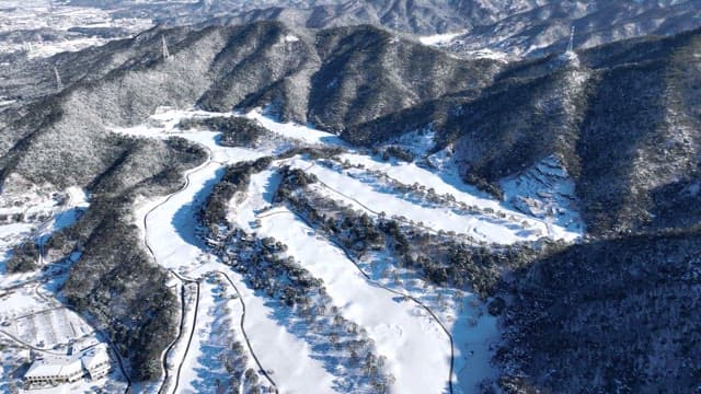 Snow-covered Mountains and River from Above