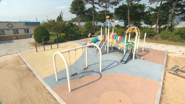 Empty playground with swings and slides