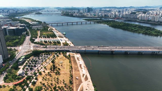Aerial view of a city with a river and bridges