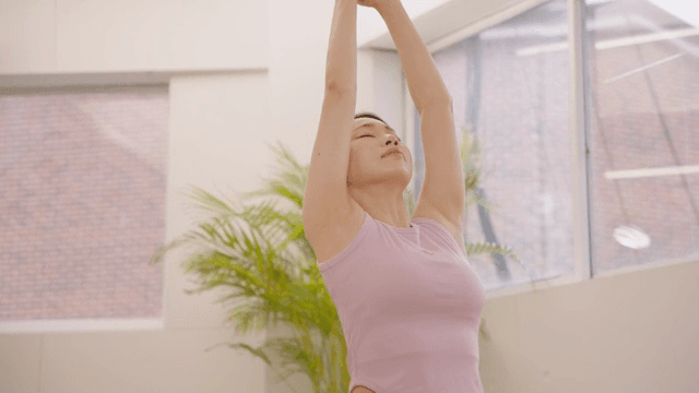 Woman practicing yoga indoors