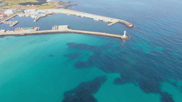 Coastal harbor with clear blue waters