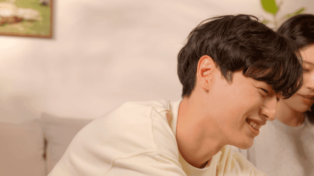 Couple organizing clothes in cozy living room