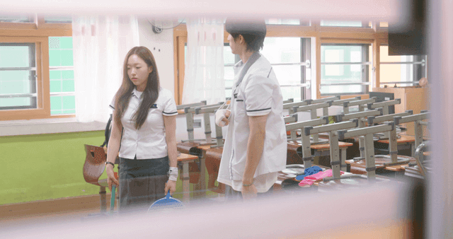 Students cleaning a classroom together