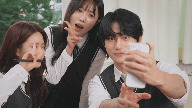 Students taking a selfie in a classroom