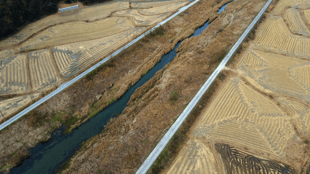 Expansive farmland with narrow streams