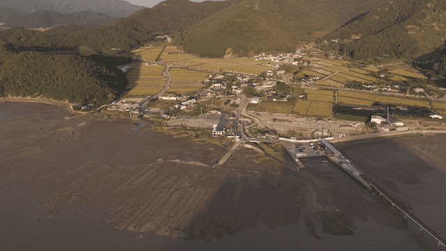Coastal village with surrounding fields