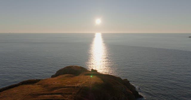 Sunset over a tranquil coastal seascape