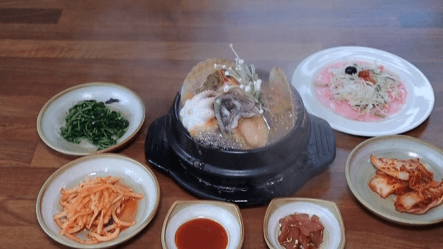 Korean seafood stew with side dishes
