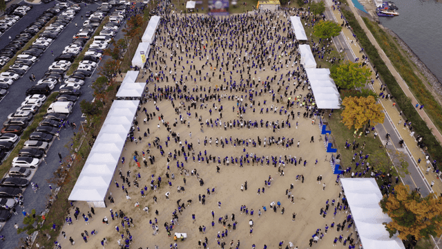 Large crowd gathered at outdoor event venue