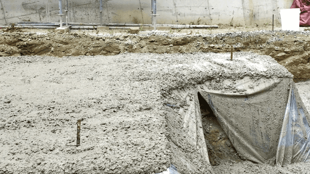 Construction site with concrete and worker