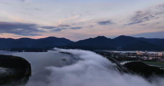 Serene landscape with mountains and clouds