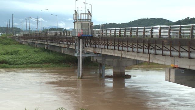 Concrete bridge over a swollen river