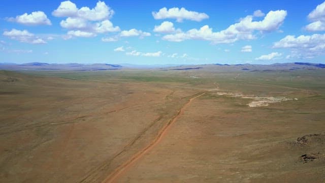 Vast open landscape under a blue sky