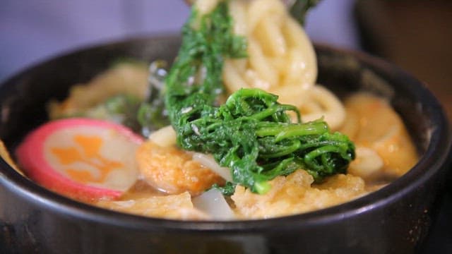 Bowl of warm udon with fresh vegetables