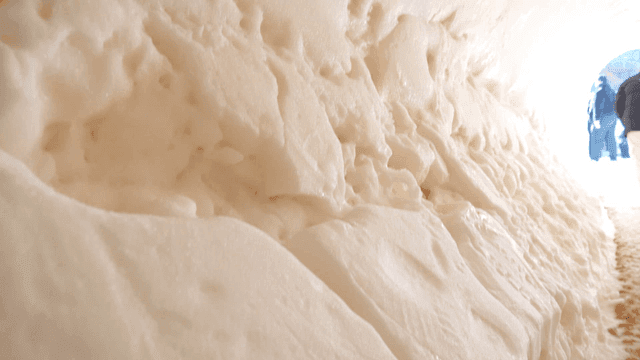 Snow-covered tunnel where people walk