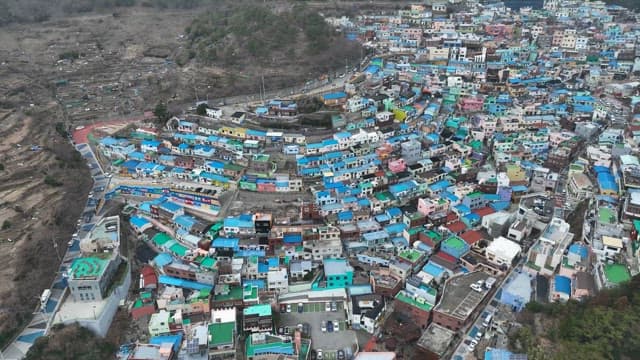 Colorful hillside village with vibrant rooftops