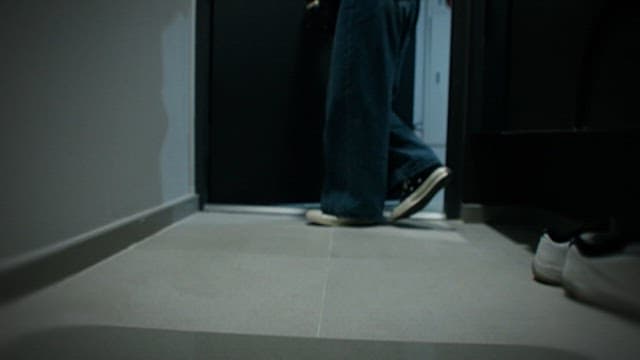 Woman Surprised After Entering a Dark House