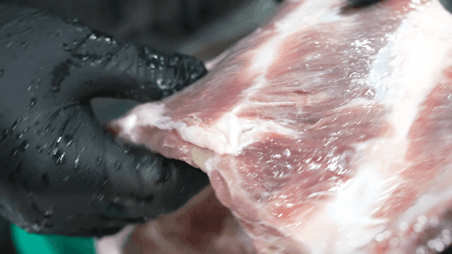 Glovenly hand touching ribs