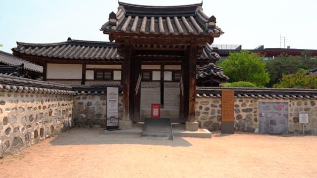 Entrance to a traditional Korean house under bright daylight