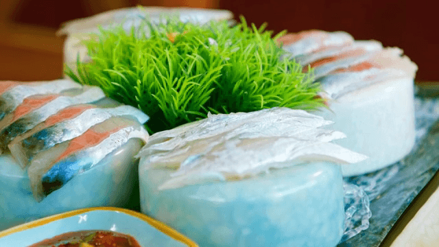 Fresh sashimi slices on a decorative plate