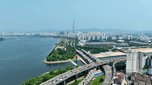 Bustling city with river and highway
