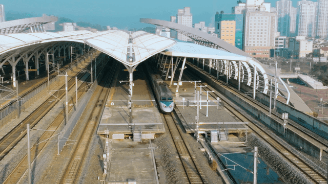 High-speed train arriving at modern station