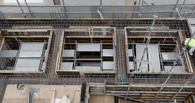 Construction site with workers and materials