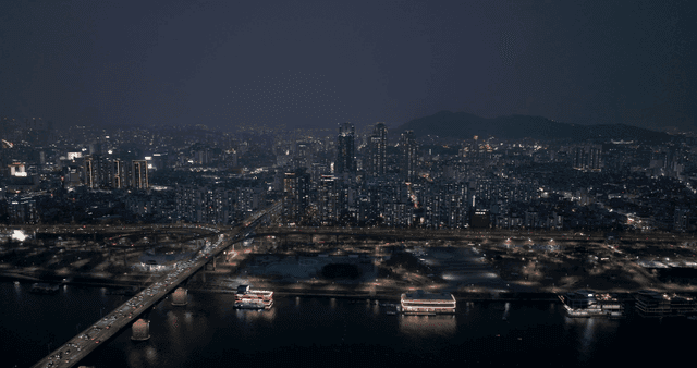 Night view of a bustling city with skyscrapers