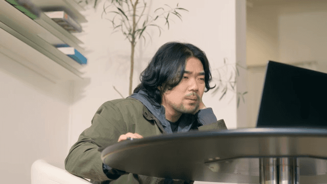 Angry man working on laptop