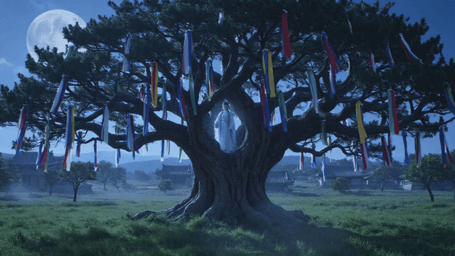 Large tree decorated with colorful cloth under moonlight