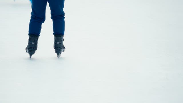 People ice skating at a rink