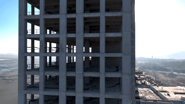 Unfinished building near a coastal area
