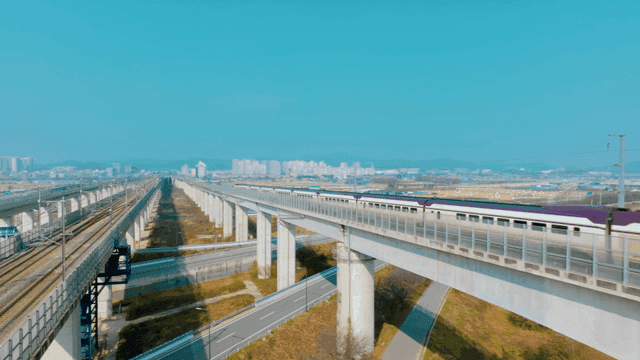 High-speed trains running fast on elevated tracks