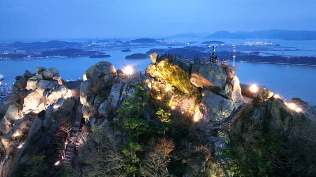 Scenic view of a rocky hilltop at dusk