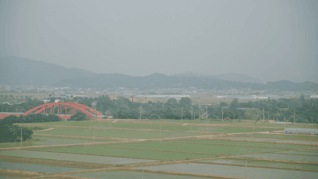 Large farmland with red bridges
