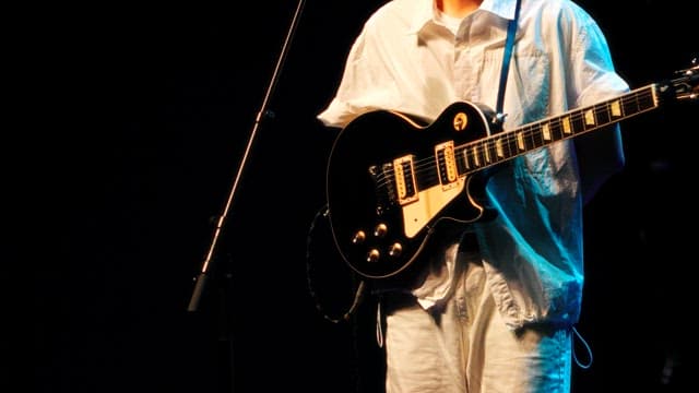 Musician Playing Electric Guitar On Stage
