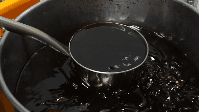 Ladle for stirring soy sauce in large pot