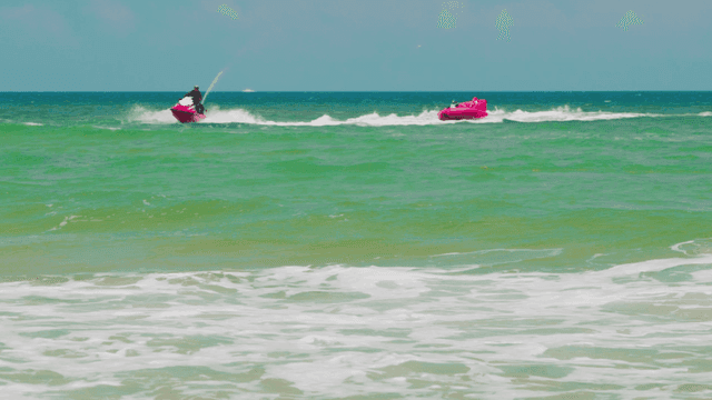 People enjoying jet ski on the sea