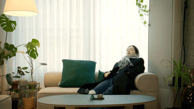 Cozy living room where woman is resting