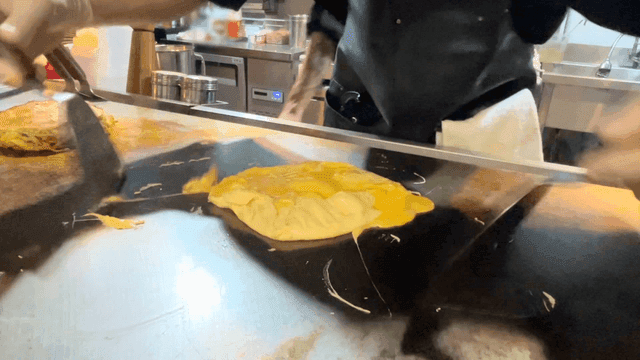 Cooking an omelette on a hot griddle