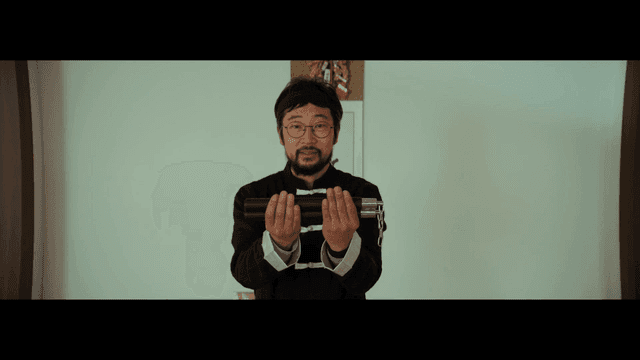 Man holding nunchucks