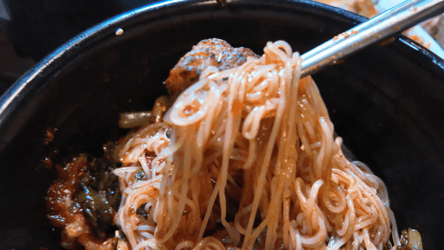 Spicy bibim noodles and grilled pork belly