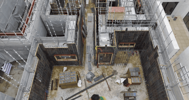 Construction site with scaffolding and workers