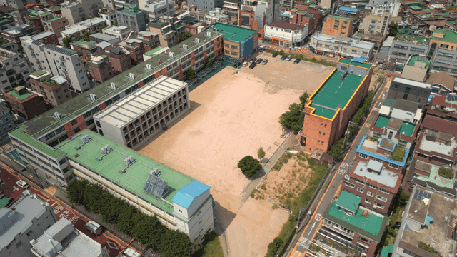 Aerial view of a school in a city