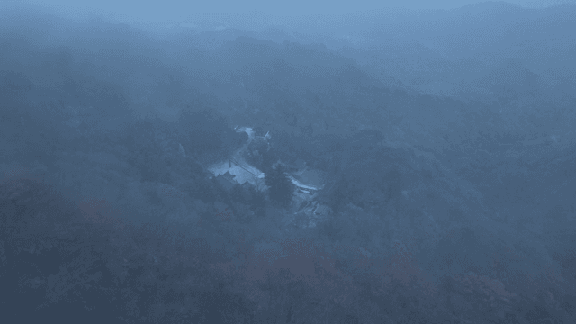 Serene mountains shrouded in fog