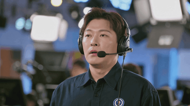 Man concentrating with headphones on in studio