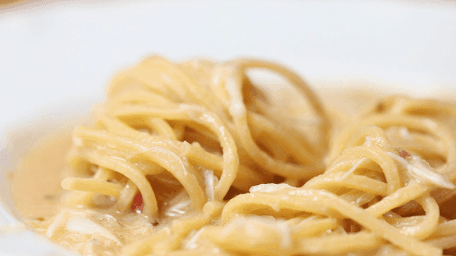 Creamy pasta with sauce on a plate