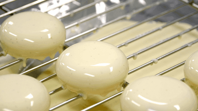 Glazed desserts on a cooling rack
